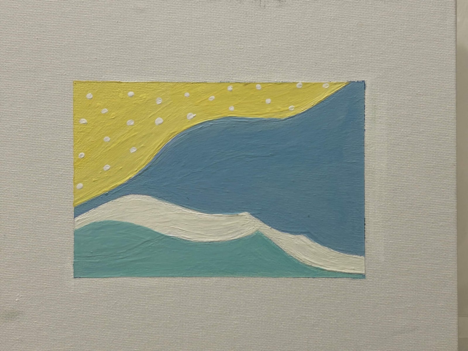 Bold-color abstract of yellow sky over blue water and green hill