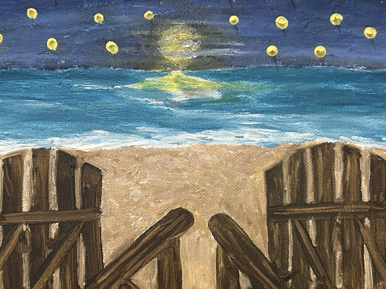 Painting of two Adirondack chairs on a beach under a moonlit sky with yellow stars
